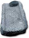 A corn Metate the bottom stone, with a Mano the upper stone.