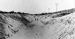 Two Boys Standing in the West Cache Irrigation Canal at Trenton, Utah
