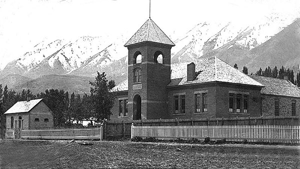 Mendon's 1899 red brick school built on the front of the older rock school