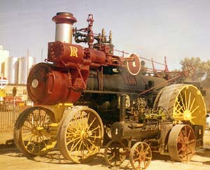 L.K. Wood's Quarter Scale Case Traction Engine next to a large Russell engine, in Lehi, Utah.